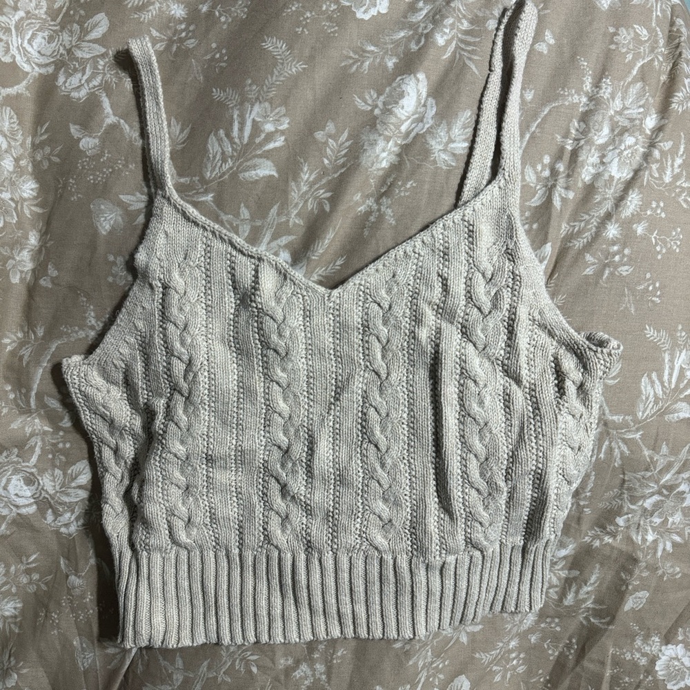 Cute boho styled, knitted tank top. Comfortable and slightly cropped.